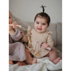 Mushie Flower Training Toothbrush 32 Mushie Flower Training Toothbrush -Tiny Baby Essentials Store soft lilac toothbrush lifestyle